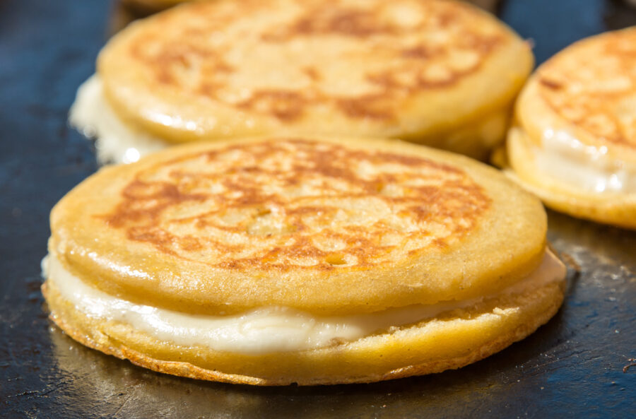 Cheese Arepas being cooked in a Fast food stand in Bogota (Colombia)