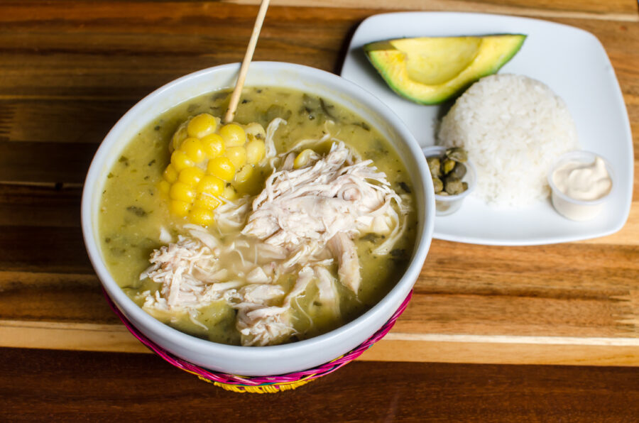 Traditional Colombian soup made with three varieties of potatoes, chicken breasts, corn and guasca herb. It is garnished with capers, avocado slices and cream.