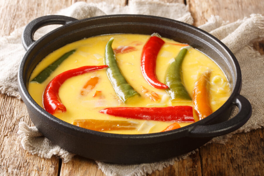 Ema Datshi Bhutanese Chili and Cheese Stew closeup in the pan on the table. horizontal