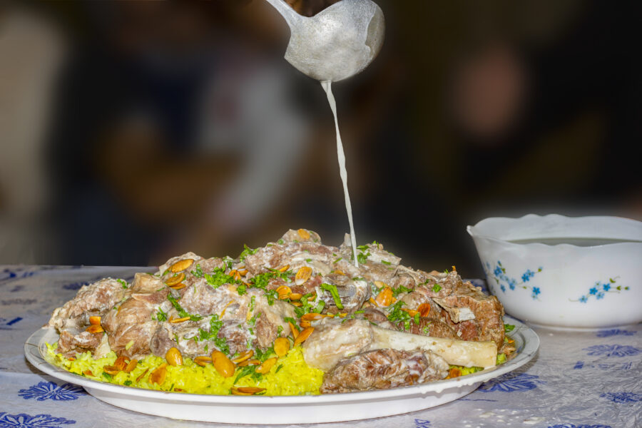 Mansaf, a traditional Arab dish made of lamb cooked in a sauce of fermented dried yogurt and served with rice or bulgur.