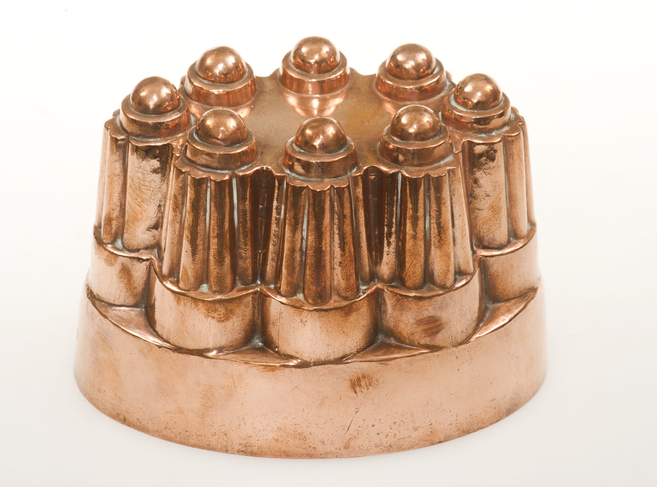 an antique metal jelly mould taken in studio